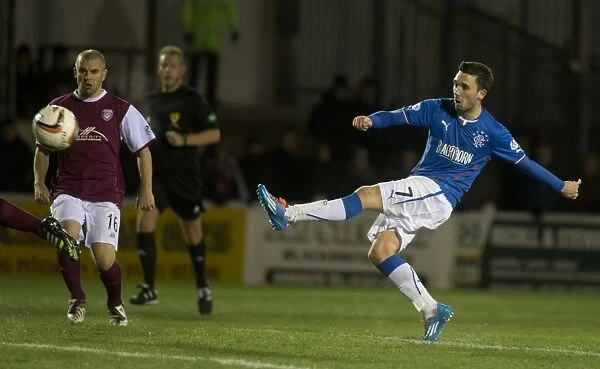 Rangers Nicky Clark Aims for Glory: Attempting a Strike at Arbroath's Gayfield Park in Scottish League One