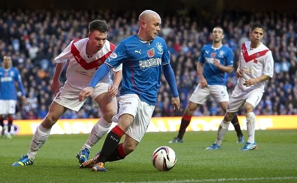 Rangers Nicky Law Protects the Ball at Ibrox Stadium during Rangers vs Airdrieonians (Scottish Cup Champions 2003)