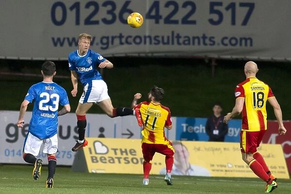 Rangers Ross McCrorie Clears the Ball in Intense Betfred Cup Quarterfinal