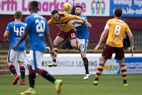 Rangers Russell Martin Soaring Over Rival Ryan Bowman in Epic Motherwell Clash