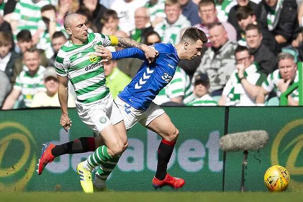Rangers Ryan Jack Fends Off Celtic's Scott Brown in Scottish Premiership Clash at Celtic Park