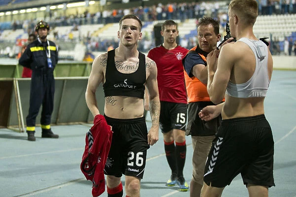 Rangers Ryan Kent Celebrates with Ecstatic Fans: Shirt-Throwing Triumph at NK Osijek's Stadion Gradski