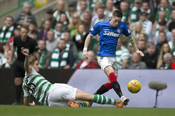 Rangers Ryan Kent Soars Over Celtic's Kristoffer Ajer in Epic Ladbrokes Premiership Clash at Celtic Park