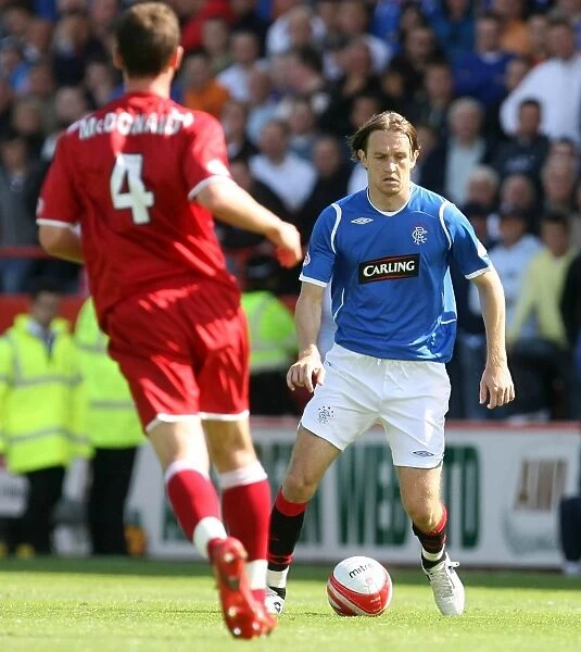Rangers Sasa Papac Faces Off Against Aberdeen: A 1-1 Clydesdale Bank Premier League Stalemate at Pittodrie
