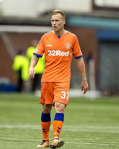 Rangers Scott Arfield in Action: The Thrilling Betfred Cup Clash at Rugby Park