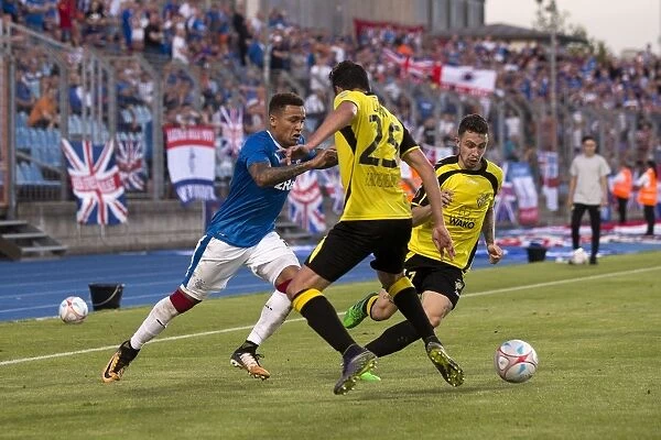 Rangers Tavernier Fights for Ball in Europa League Battle at Stade Josy Barthel Stadium
