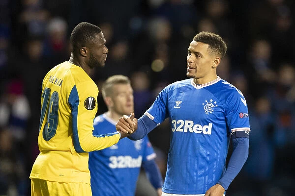 Rangers Tavernier and Mbemba Share a Moment after Rangers 2-0 Europa League Victory over Porto (Ibrox Stadium)
