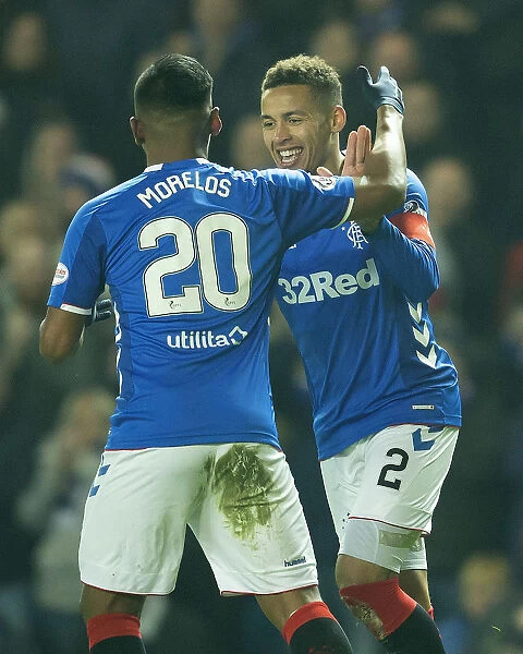 Rangers Tavernier and Morelos: Celebrating a Goal in Ibrox Stadium - Scottish Premiership Victory and Scottish Cup Champions (2003)