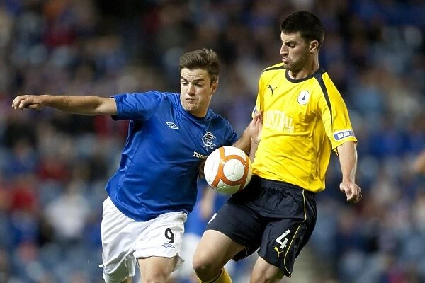 Rangers Triumph: Andy Little Scores the Decisive Goal in a 3-0 Scottish League Cup Victory over Falkirk at Ibrox Stadium