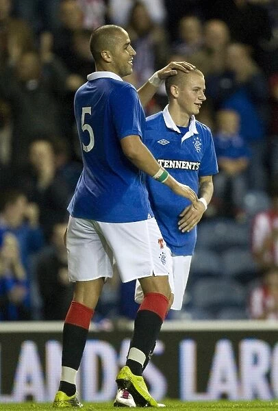 Rangers Triumph: Bougherra and Weiss's Goal Celebrations in 7-2 CIS Insurance Cup Victory over Dunfermline at Ibrox Stadium