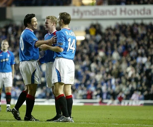 Rangers Triumph: Celebrating a 4-1 Victory with Ronald de Boer, Mols, and Ball