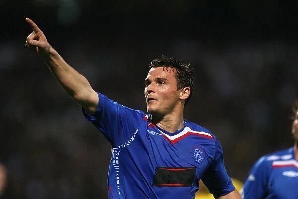 Rangers Triumph: Lee McCulloch's Euphoric Moment as He Scores the Opening Goal Against Olympique Lyonnais in the UEFA Champions League (3-0)
