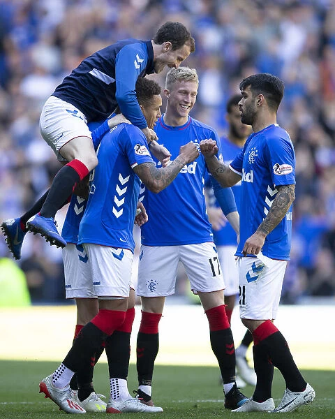 Rangers Triumph: Tavernier and Halliday Celebrate Scottish Premiership Victory at Ibrox Stadium