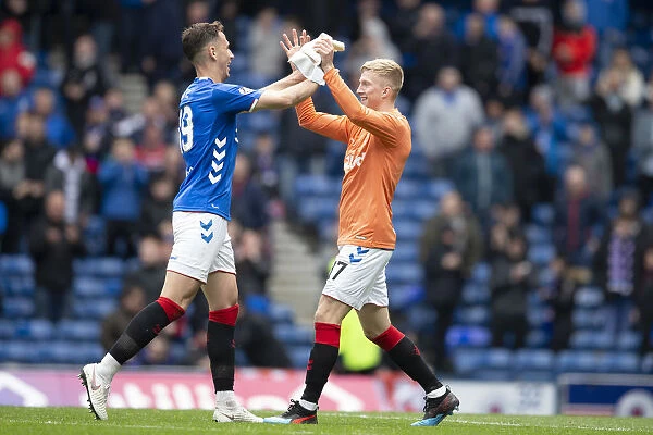 Rangers Victory Amid Controversy: McCrorie and Katic Celebrate at Ibrox after McGregor's Red Card (Scottish Premiership: Rangers vs Hibernian)