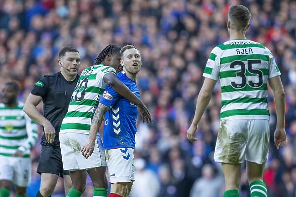 Rangers vs Celtic: Intense Moment as Scott Arfield Confronts Kris Ajer Amidst Heated Rivalry at Ibrox Stadium