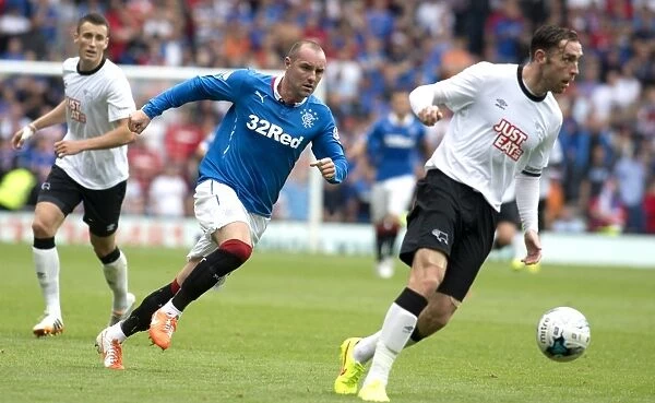 Rangers vs Derby County: Kris Boyd's Intense Battle for the Ball - Scottish Cup Champions Clash (Friendly Match)