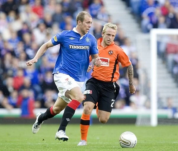 Rangers vs Dundee United: Steven Whittaker vs Johnny Russell - Thrilling 4-0 Showdown at Ibrox Stadium (Scottish Premier League)