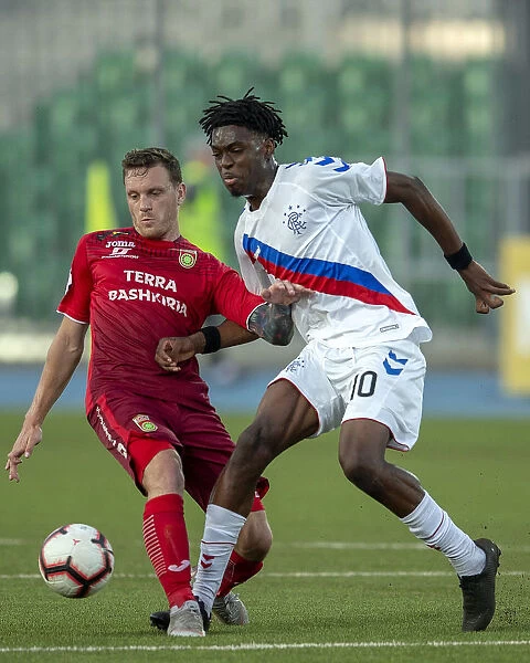 Rangers vs FC Ufa: Ovie Ejaria's Intense Battle for the Ball in Europa League Play Off at Neftyanik Stadium