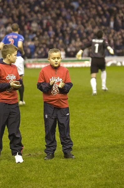 Rangers vs Hearts: A 2-1 Victory Battle in the Clydesdale Bank Premier League - Celebrating with Rangers and Cash for Kids Mascots at Ibrox