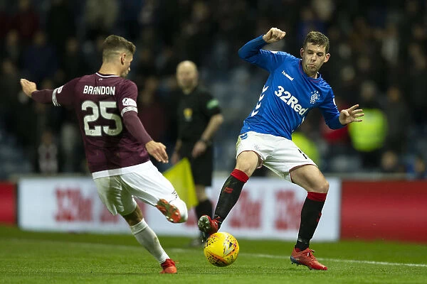 Rangers vs Hearts: Jon Flanagan Tackles Jamie Brandon in the Scottish Premiership at Ibrox Stadium
