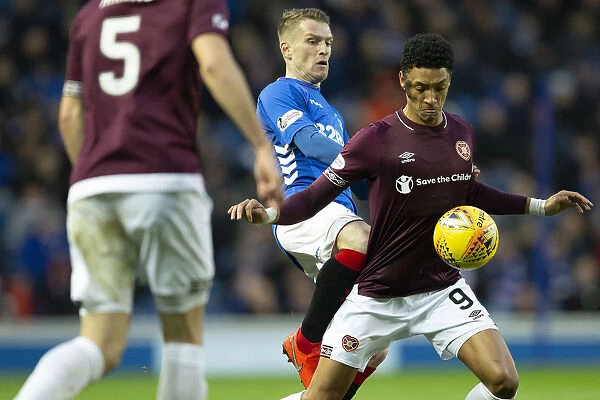 Rangers vs Hearts: Steven Davis Tackles Sean Clare in the Scottish Premiership at Ibrox Stadium