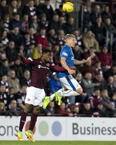 Rangers vs Hearts: Thrilling Moment - Martyn Waghorn Soars Over Lennard Sowah at Tynecastle Stadium