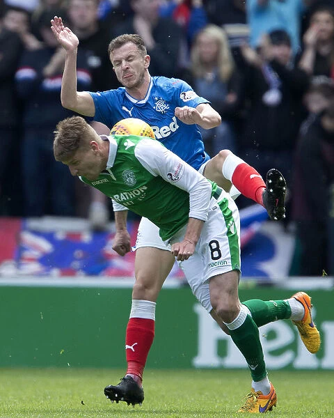 Rangers vs Hibernian: Andy Halliday Tackles Vykintas Slivka - Intense Moment in the Ladbrokes Premiership Clash at Easter Road