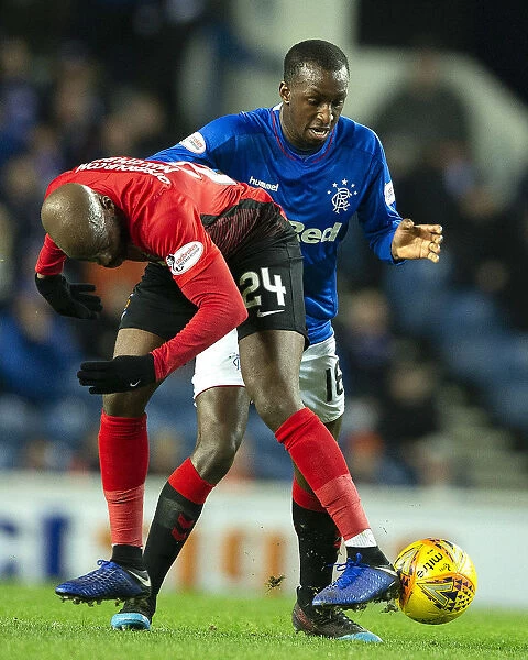 Rangers vs Kilmarnock: Glen Kamara Tackles Youssouf Mulumbu in Fifth Round Scottish Cup Replay at Ibrox Stadium
