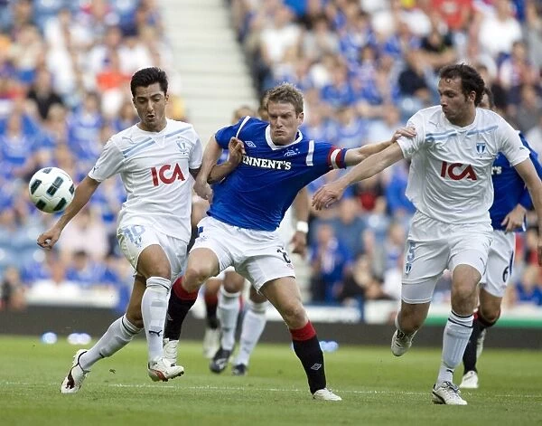 Rangers vs Malmo FF: Steven Davis Clashes with Hamad and Mutavdzig in UEFA Champions League Qualifier at Ibrox Stadium (1-0 in Favor of Malmo)