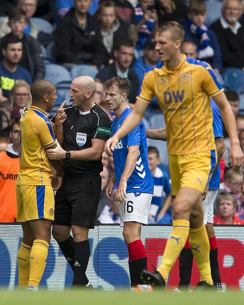 Rangers vs Wigan Athletic: Vaughn's Controversial Protest to Referee Madden at Ibrox Stadium