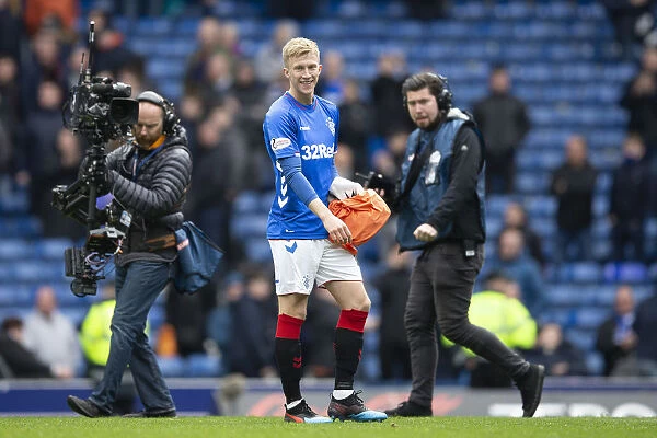 Ross McCrorie's Dramatic Goalkeeping Debut: Celebrating a Red Card Victory at Ibrox Stadium