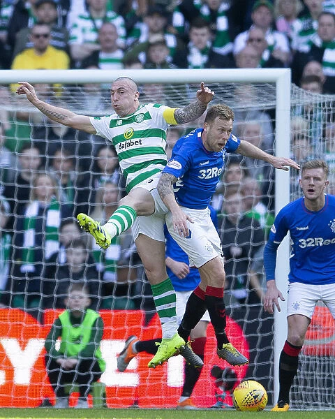 Scott Arfield Leaps Over Scott Brown in Intense Celtic vs. Rangers Rivalry, Scottish Premiership, Celtic Park