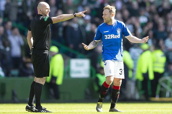 Scott Arfield and Referee Bobby Madden in Intense Discussion during Celtic v Rangers Scottish Premiership Match at Celtic Park