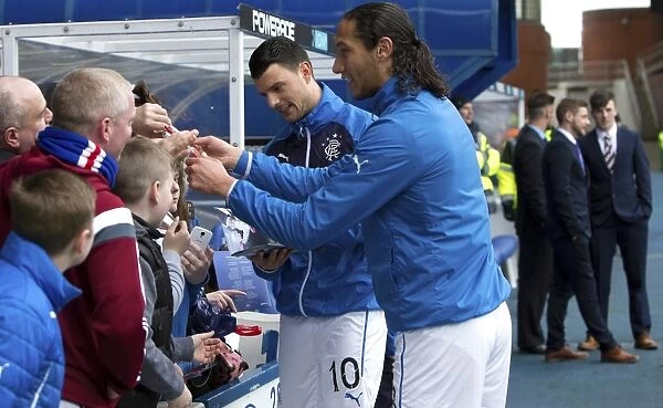 Scottish Cup Victory: Rangers Bilel Mohsni and Haris Vuckic Celebrate with Fans at Ibrox Stadium