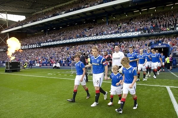 Steven Davis and the Mascots: Leading Rangers and Heart of Midlothian onto Ibrox Stadium's Field (1-1 Clydesdale Bank Scottish Premier League)