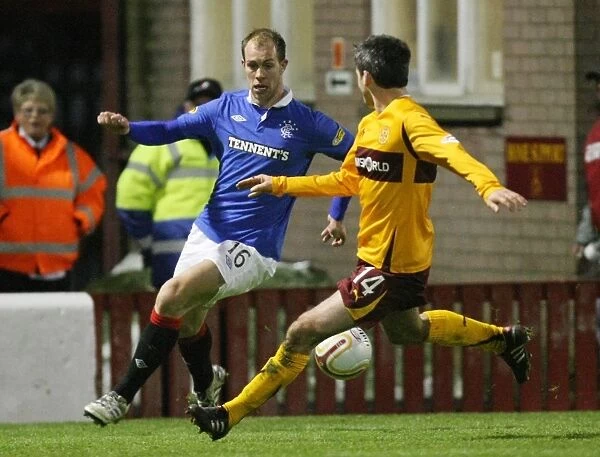 Steven Whittaker and Keith Lasley in Action: Rangers Dominance over Motherwell in the Clydesdale Bank Scottish Premier League - 4-1 Victory at Fir Park