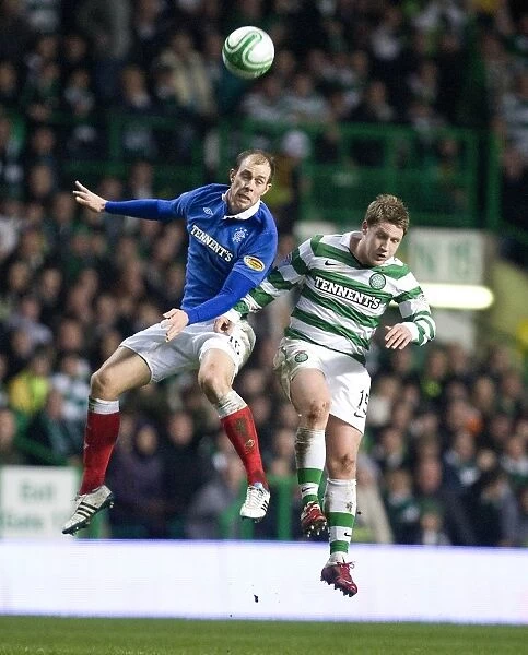 Steven Whittaker vs Kris Commons: A Riveting Rivalry - Rangers vs Celtic's Scottish Cup Fifth Round Replay Clash at Celtic Park (1-0 in Favor of Celtic)