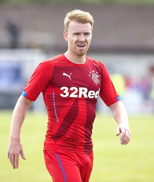 Stevie Smith of Rangers Facing Off Against Brora Rangers at Dudgeon Park: Pre-Season Friendly Encounter between Scottish Cup Champions