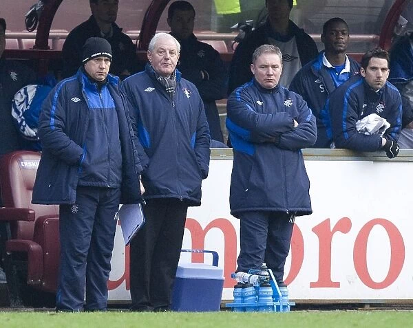 A Tense Moment at Tynecastle: Smith, McCoist, and McDowall's Reaction as Hearts Lead 1-0 Against Rangers