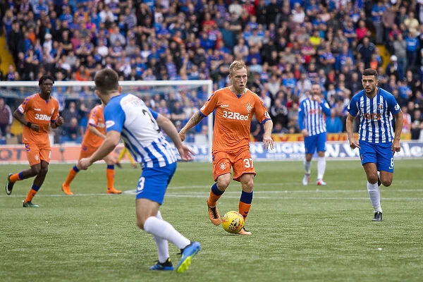 Thrilling Betfred Cup Clash: Rangers Scott Arfield in Action at Kilmarnock's Rugby Park