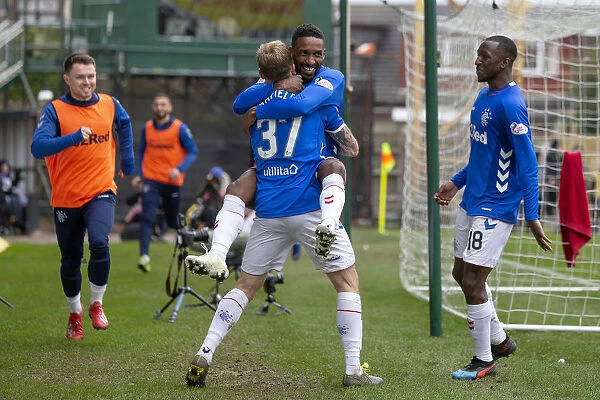 Triple Threat: Arfield and Defoe's Euphoric Celebration of Rangers Hat-Trick Against Motherwell
