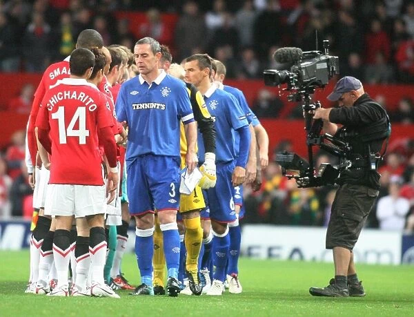 A United Front in UEFA Champions League: David Weir's Historic Handshake at Old Trafford (0-0) - Manchester United vs Rangers