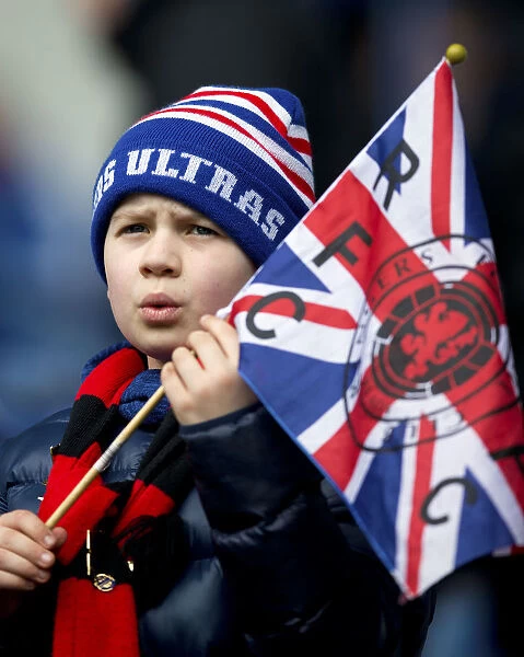 Young Rangers Fan Waving Union Jack at Ibrox: Passionate Support Amidst Rangers vs Dundee Match