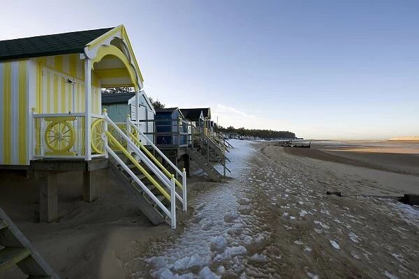 View of beach huts in snow, Wells-next-the-sea, Norfolk, England, december