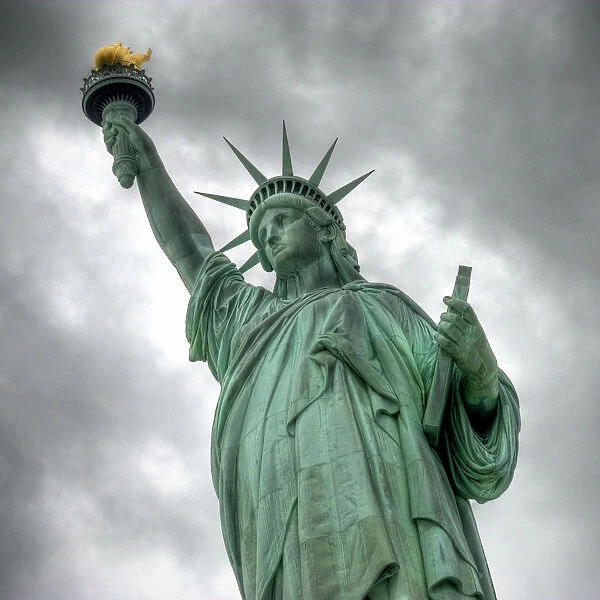 The Statue of Liberty (NYC) under a cloudy sky