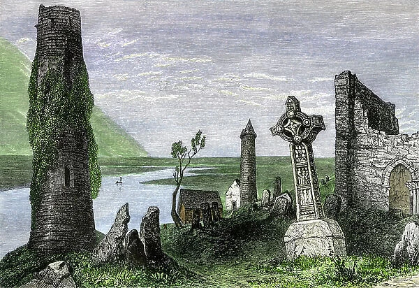 Celtic crosses among the ruins of the 6th century Clonmacnoise Abbey in Ireland along the Shannon River. Colour engraving of the 19th century
