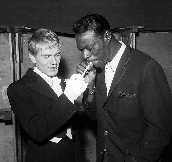 Adam Faith with Nat King Cole taking a break from rehearsing for the Royal Variety