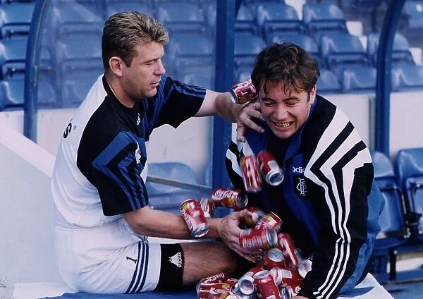 Andy Goram and Ally McCoist horsing around with Coca Cola cans in build up to Celtic