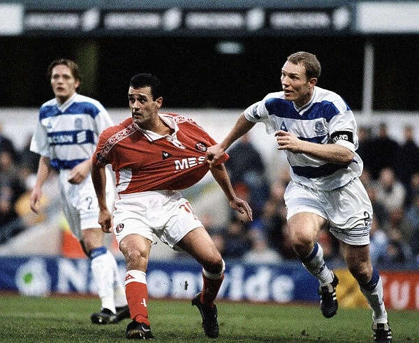Clive Mendonca of Charlton has his shirt pulled by Tim Breacker of Queens Park Rangers