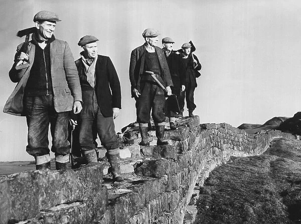 Hadrians Wall - workmen on restoration work pause foor a break as they walk along